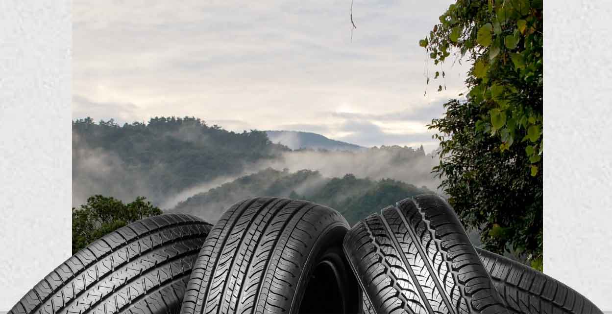 Tire Pile in front of Scenic Background
