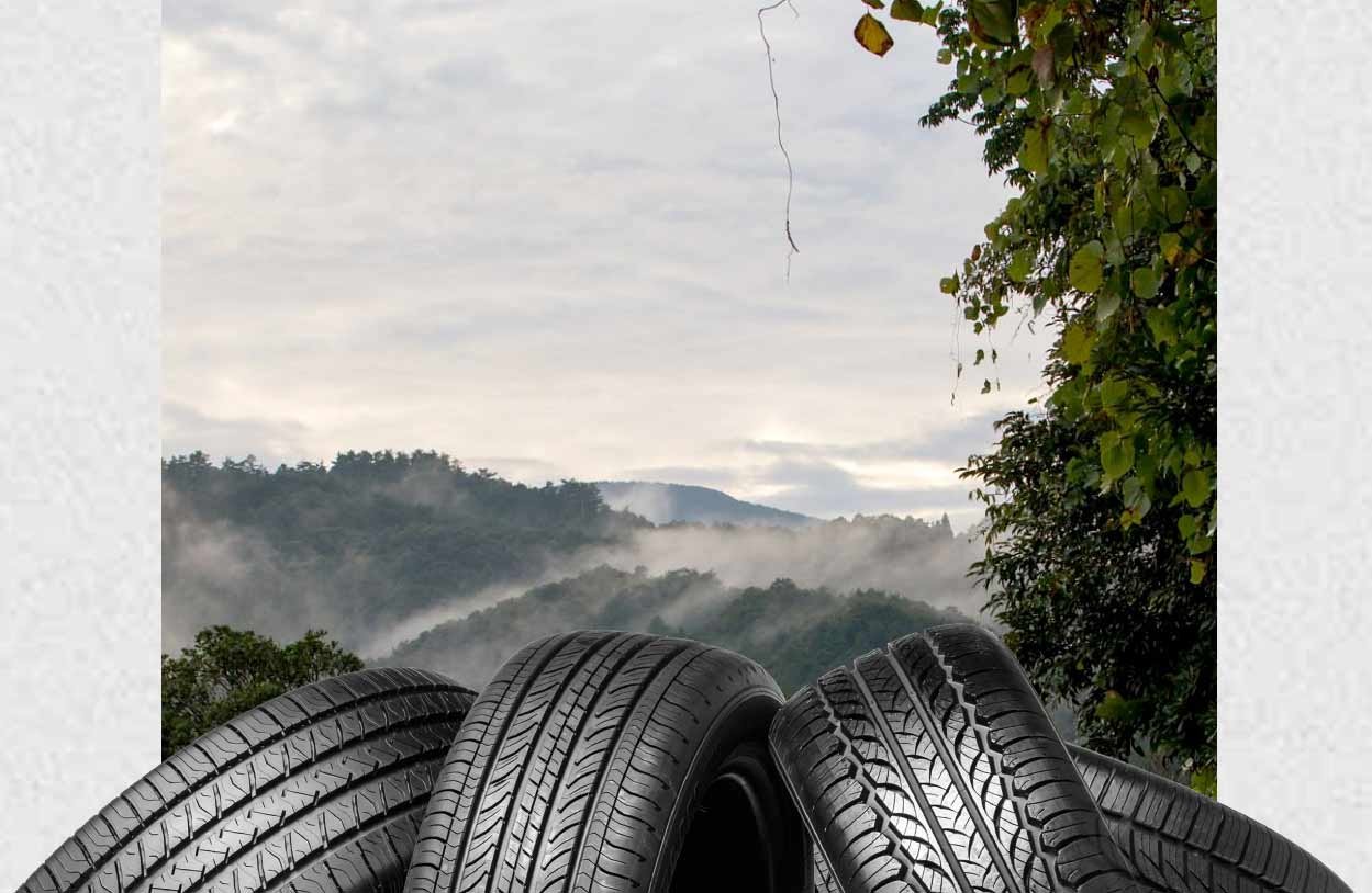 Tire Pile in front of Scenic Background